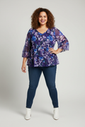 Purple Floral Peplum Top on plus-size model